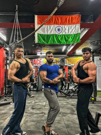 Another shot with the team. The classic side chest pose, showing the results of our hard work and dedication.