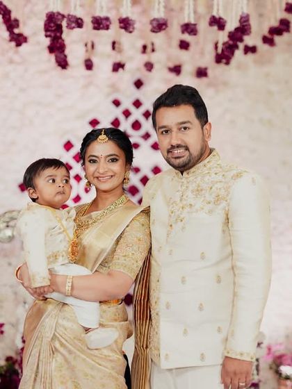 A formal family portrait showcasing our coordinated designs. The cream and gold color palette creates a regal and unified look, perfect for milestone celebrations like this one.
