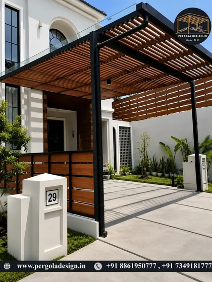 Here, we combined a strong black steel frame with a warm, wood-louvered roof and side panel. A clear glass top layer ensures the structure is fully waterproof while allowing the beauty of the wood to be the main feature, creating a sophisticated driveway entrance.