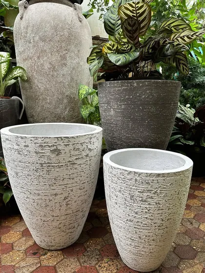 Create a beautiful pot cluster with these lightweight concrete planters. They have a unique textured surface in tones of creamy greys and whites, giving a rustic feel without the heavy weight of traditional concrete.