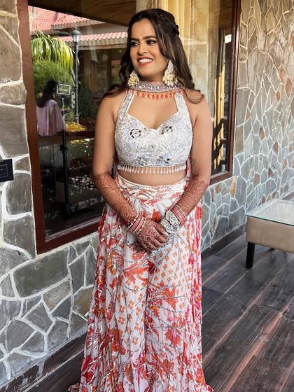 A full shot of the bride, looking radiant and ready for her pre-wedding festivities.