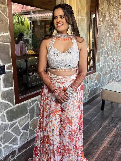 A full shot of the bride, looking radiant and ready for her pre-wedding festivities.