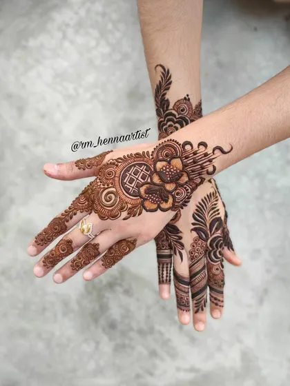 A unique design with a mix of floral, geometric, and abstract elements. I love how the two hands create a beautiful picture when placed together.
