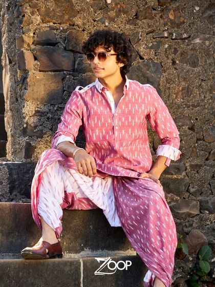 This pink ikat-print kurta and dhoti set seamlessly blends comfort and sophistication, offering a modern take on a traditional Indian look.