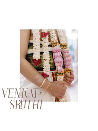 A detail shot of the groom's attire and the beautiful floral garlands (Varmala). The clean, minimalist presentation turns these traditional elements into a piece of modern art.