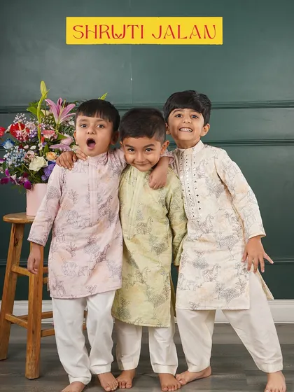 I love seeing the playful energy of little boys, and I design my kurta sets to match it. Here you can see a few of my printed designs in soft pink, pastel green, and off-white, all made from breathable fabrics that are perfect for parties and family photos.