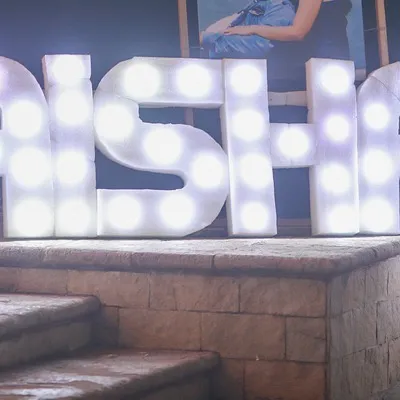 Another view of the #MAISHA marquee letters. These letters create a fantastic photo opportunity for guests and add a modern, personalized touch to the wedding decor.