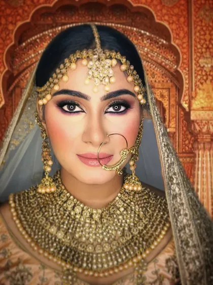 This is what I call a contemporary classic. The makeup for this bride is defined and polished, with a dewy base and neutral tones that enhance her features without overpowering them.