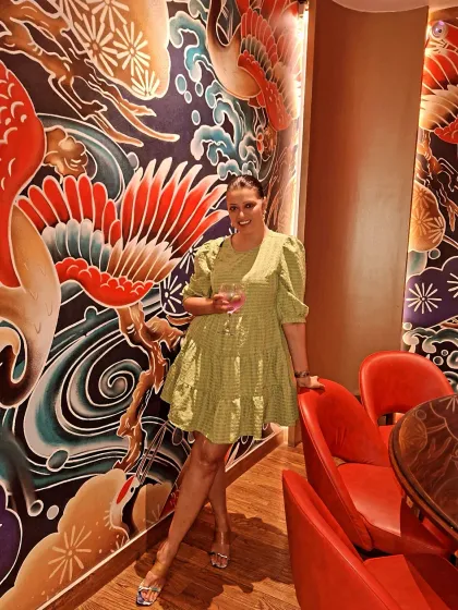Enjoying the dim sum brunch at Royal China in a cute green tiered mini dress. It's a fun, flirty, and comfortable choice for a food-filled afternoon.