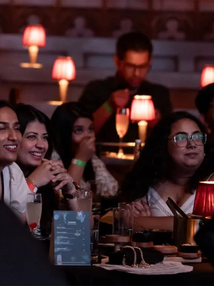 The smiles on our guests' faces say it all. This moment from our Ratatouille event captures the joy and delight of watching a beloved film while being surprised with dishes that appear as if by magic from the screen.