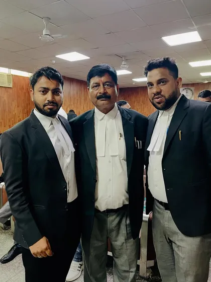 With a senior advocate and a colleague inside the court premises. Learning from experienced lawyers is a continuous process.