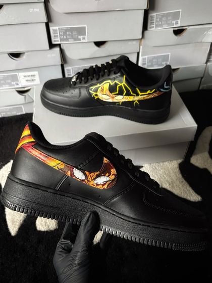 Another angle of the inner swooshes, showcasing the dynamic anime art on the black sneakers.