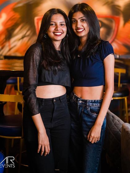 Two friends posing together.