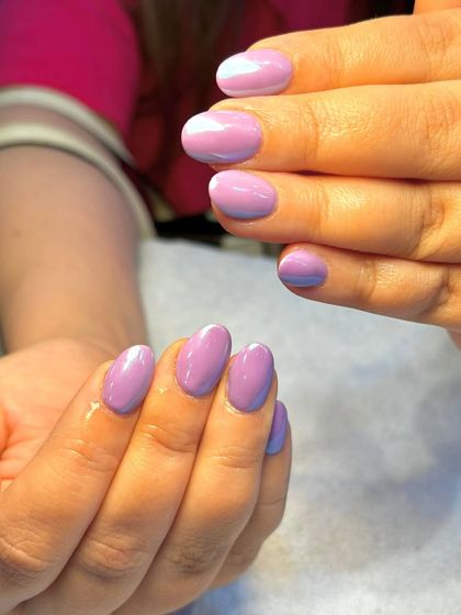 A different angle of the lilac aura nails, showing how the light catches the soft gradient of colors.