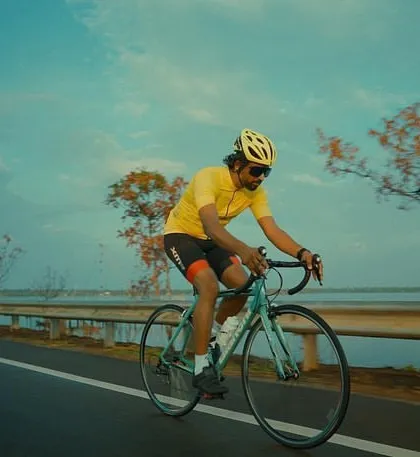 A dynamic shot of a cyclist from the "Made to Move" music video, capturing a sense of freedom and motion.