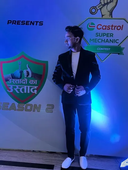 A stylish pose against the Castrol event backdrop. I believe in looking the part of a modern illusionist.