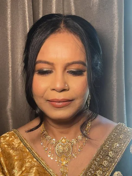 A close-up of the makeup for my client, Rama. I used a dash of shimmer and a smudged liner to define her eyes, creating a remarkable glow for her nephew's wedding.