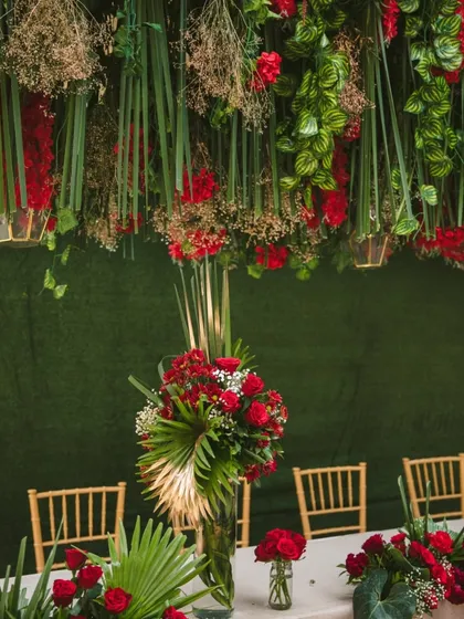 Attention to detail defines a luxury event. This tablescape features a dramatic overhead floral installation and coordinated centerpieces, creating an immersive dining experience for your most important clients and partners.