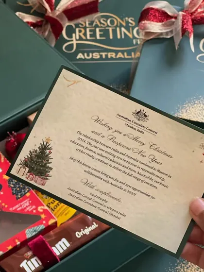 The personalized card that went inside each Christmas hamper from the Australian Consulate, wishing recipients a Merry Christmas and a prosperous New Year.