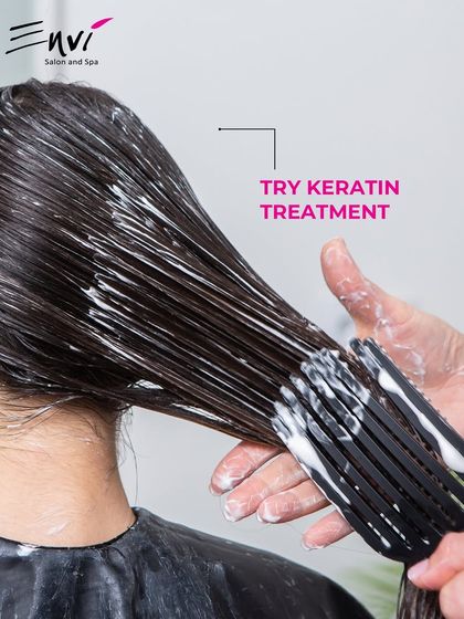 Frizz won't go away? Try our Keratin Treatment. This image shows the application process, where we meticulously coat each strand for a smooth, long-lasting result.