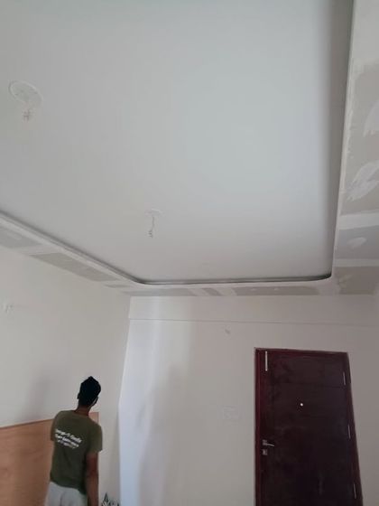Work in progress on a false ceiling. This design features a simple, clean border that will house recessed lighting, adding a layer of ambient light to the room.
