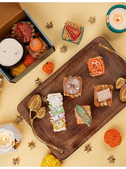 A beautiful flat-lay of my Mithai soaps on a wooden tray, showing the variety of shapes and colors.