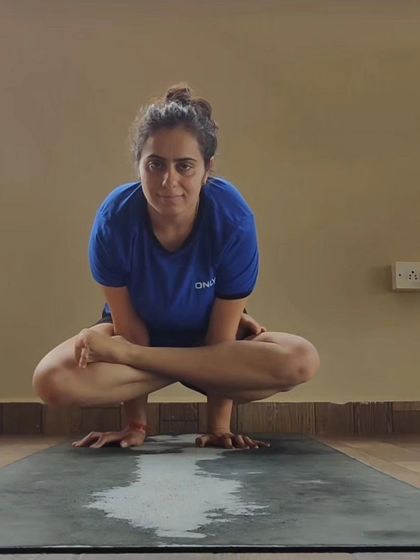 Kukkutasana (Rooster Pose) is an advanced arm balance performed from Lotus Pose. It requires strong arms, wrists, and core, as well as open hips to get into the initial position.