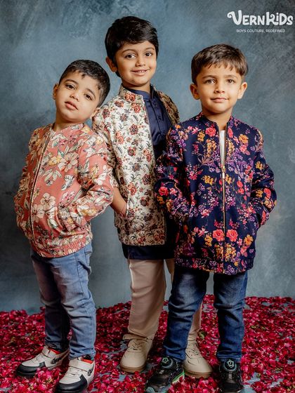 A trio of trendsetters. These boys model our popular floral bomber jackets, showing how they can be styled with jeans for a cool, casual-formal look.
