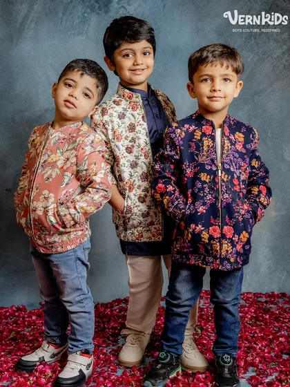 A trio of trendsetters. These boys model our popular floral bomber jackets, showing how they can be styled with jeans for a cool, casual-formal look.