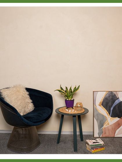 A classic Snake Plant in a purple pot. Known for its air-purifying qualities and tolerance for neglect, the Snake Plant is a must-have for any busy office.