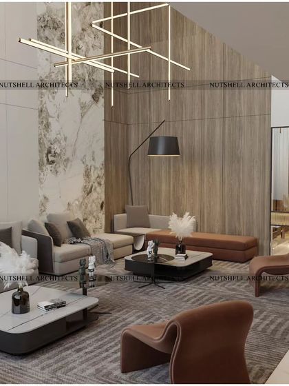 This living area showcases a mix of rich textures, from the wooden feature wall to the marble accents and plush, modern furniture. The open layout connects seamlessly to a smaller, more intimate seating area, offering flexible options for socializing.