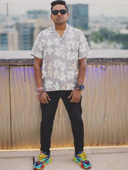A full-length shot from a rooftop venue before my set. The city skyline provides an incredible backdrop for an evening of music.