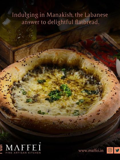 A classic Manakeesh topped with a blend of cheese and za'atar, baked until the crust is golden and the cheese is melted and bubbly.
