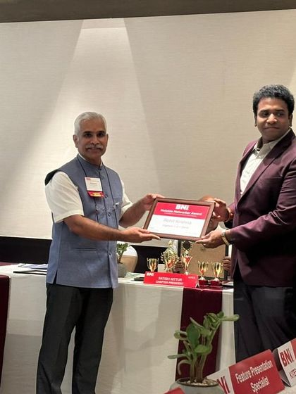 Receiving the certificate of recognition from BNI. We are thankful for the acknowledgment of our contributions.