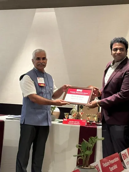 A formal photograph from the BNI recognition event.