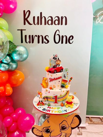 The full setup for Ruhaan's first birthday, with the colorful, toy-themed cake taking center stage. It was a joy to create this centerpiece for such a special milestone.