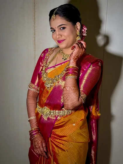 A closer look at Namratha's Muhurtham makeup. The skin is smooth and glowing, and the lip color perfectly complements her vibrant Kanchivaram saree.