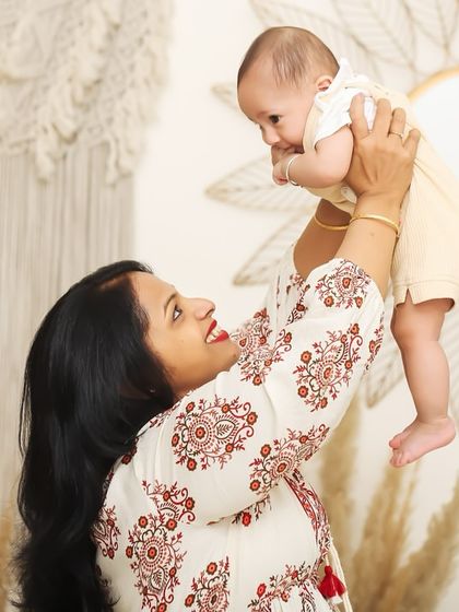 A grandmother's love is a special gift. Capturing multiple generations in one frame, like this tender moment between a grandmother and her grandbaby, creates a priceless family heirloom.