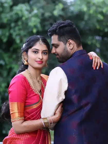 This is a candid moment from Akshatha's engagement. I created a fresh and natural makeup look that enhanced her features without feeling heavy, perfect for a daytime ceremony and capturing genuine moments like this.