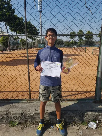 Riddhiman Ojha with his winner's trophy after the Under-16 CS7 tournament in Rohtak.