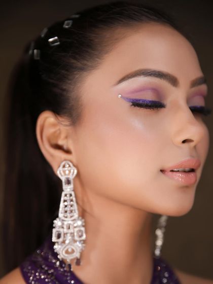 A close up of the purple winged liner with a touch of shimmer. This look is perfect for an engagement or cocktail party, adding a pop of color that is both elegant and trendy.