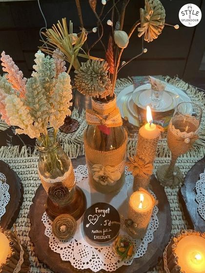 Who knew milk bottles could make such pretty DIY centerpieces? Here, I've upcycled bottles and used jute details to create a rustic and captivating table setup.