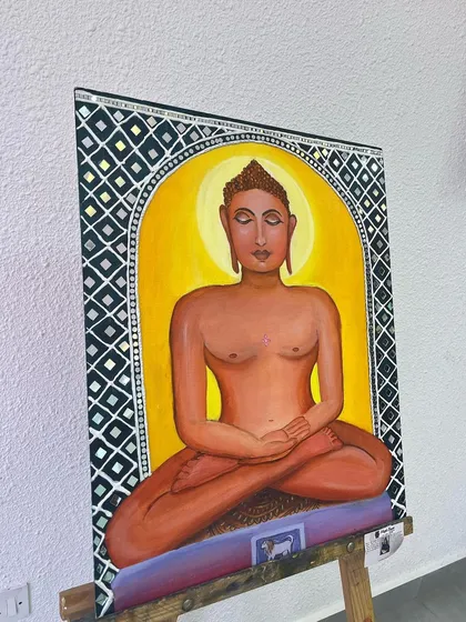 This painting of Lord Mahavir is a fusion of three art forms I love: acrylics, Lippan art, and Mandala. I carefully combined these techniques to create a piece that is both spiritually significant and visually intricate. The mirrored Lippan border adds a unique, reflective quality to the artwork.