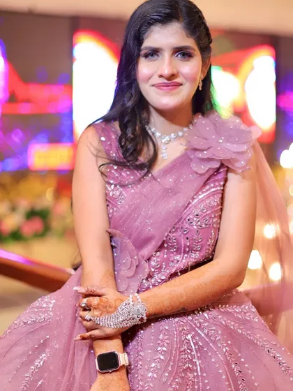 A lovely party look in a pink floral gown. The makeup is soft and romantic, with a focus on glowing skin.