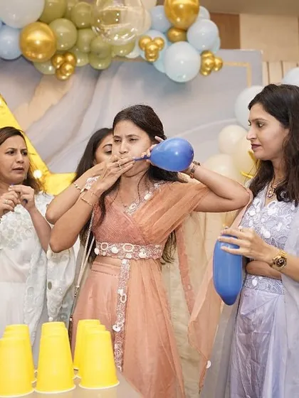 A balloon-blowing game that brought out lots of laughs. The simple, playful activities are often the most memorable.