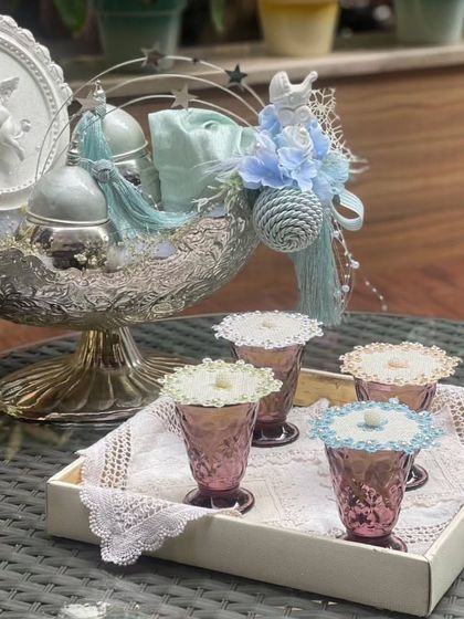 Here is another way I style my embellished glass covers. Placed on a tray with colorful glasses, they create a beautiful and cohesive look for serving welcome drinks to your guests.