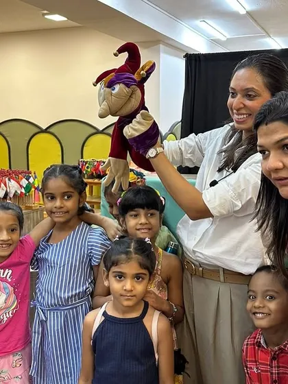 A young audience member gets to meet one of my puppet friends up close after a show at Third Environment Montessori School in Chennai. These personal interactions are so special.