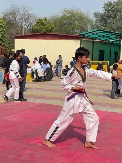 A student performing his Poomsae (form) at the Delhi Olympic Games. We place equal importance on mastering forms for discipline and precision.