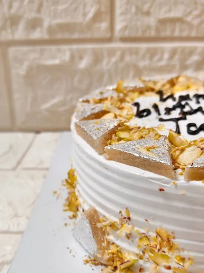A close-up of my custom Kaju Katli Cake, made for a special birthday. I love adding personal touches like handwritten messages to make your celebrations even more memorable.