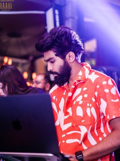 "WHATEVER IT TAKES." A focused shot of me at the decks at Raahi, showing my dedication to the craft.